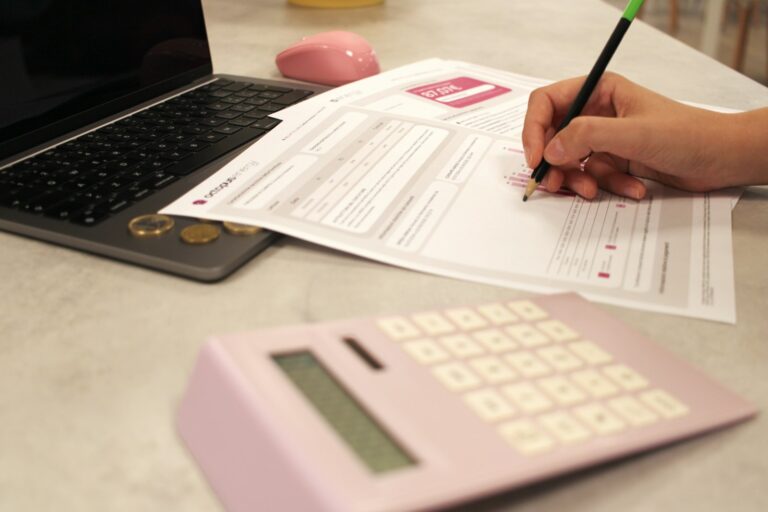 Hand writing investment plan paper calculator