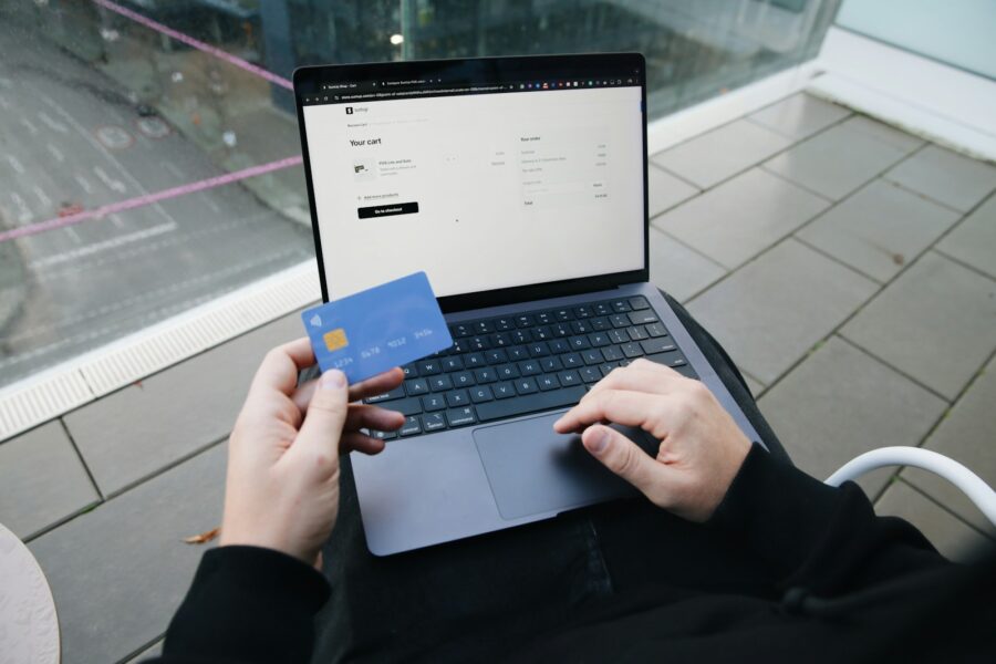 Person checking credit score laptop