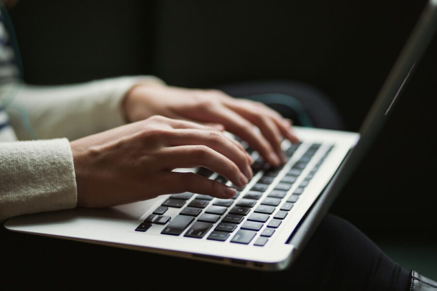 Person laptop online brokerage account screen
