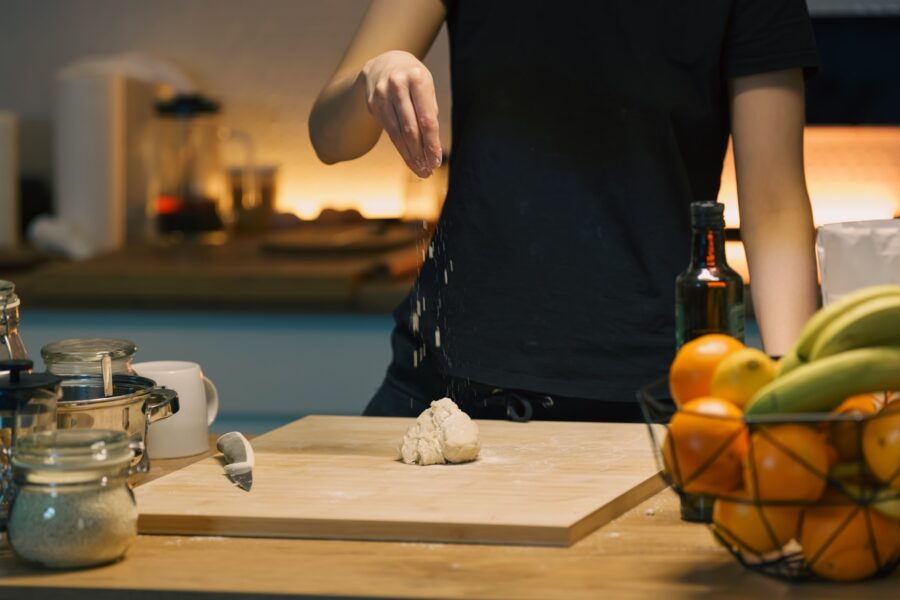 Person preparing simple home lunch kitchen counter