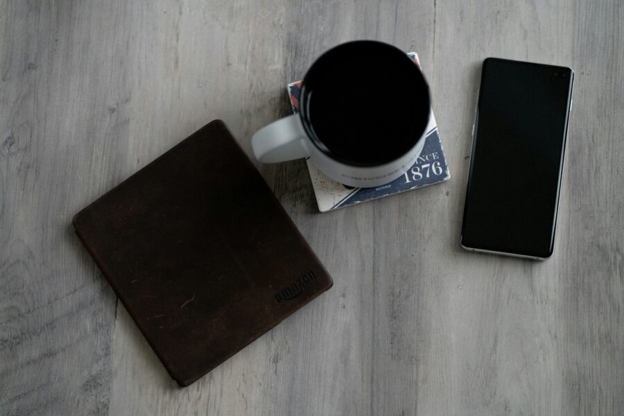 Notebook smartphone coffee table receipts