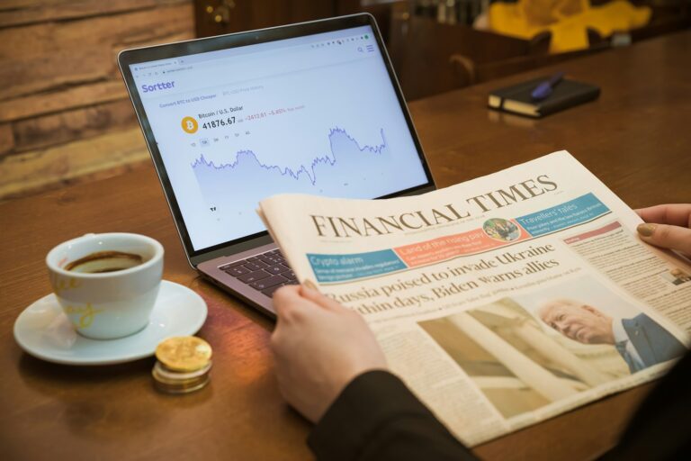 Worried person reading financial news