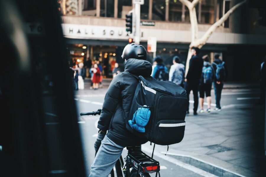 Courier delivering groceries city street backpack