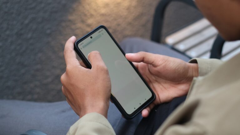 Person using mobile banking app indoors