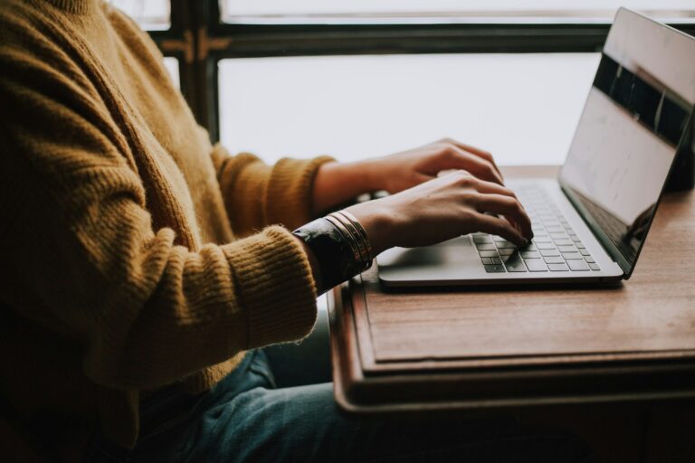 Person scheduling bank transfer laptop