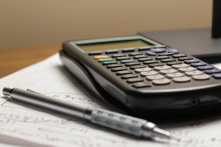 Notebook written financial goals calculator