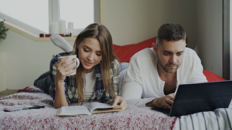 Woman checking finances laptop notebook couple reviewing bills
