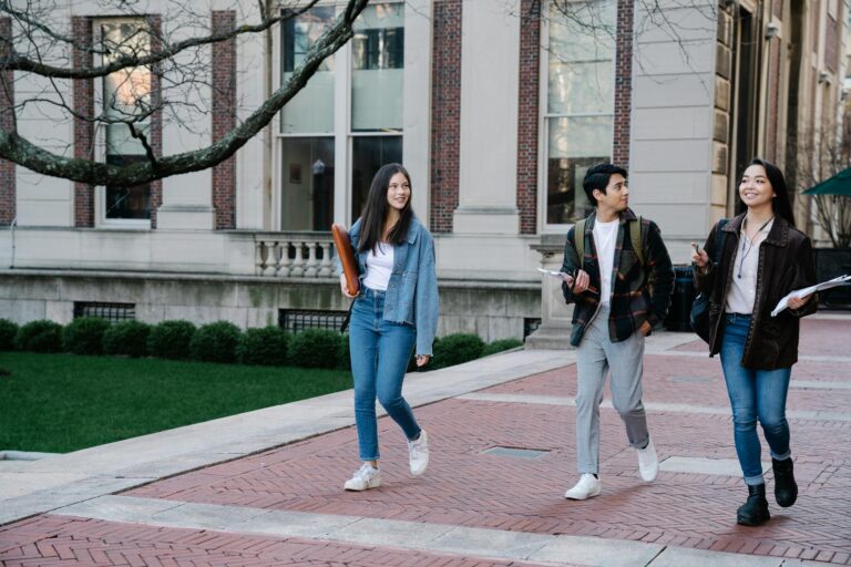 University campus students walking path student using online