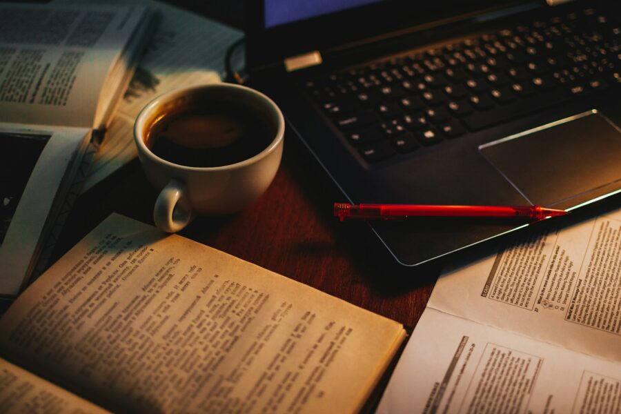 Student studying desk notebook laptop coffee