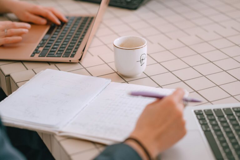Student studying desk notebook laptop coffee