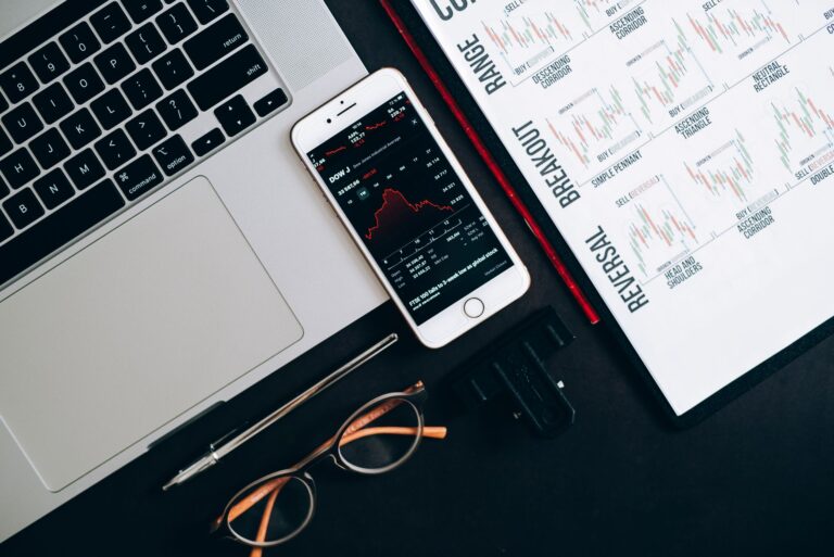 Investment pie chart laptop desk bond stock market