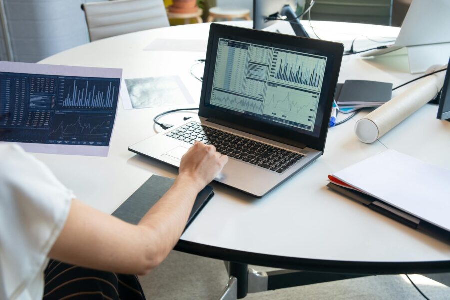 Office workers financial charts laptop