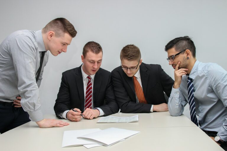 Diverse investors discussing risk profile table