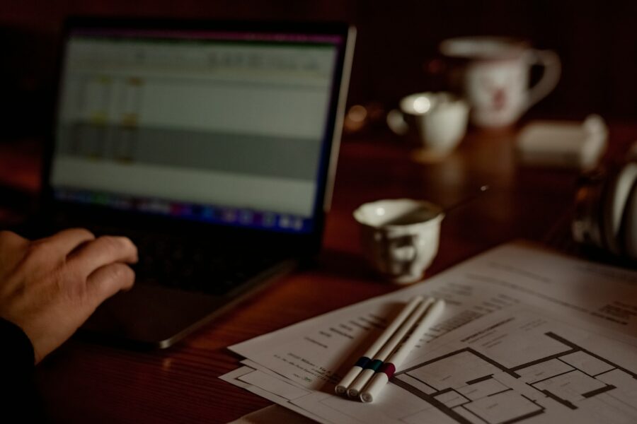 Person checking investment chart home desk