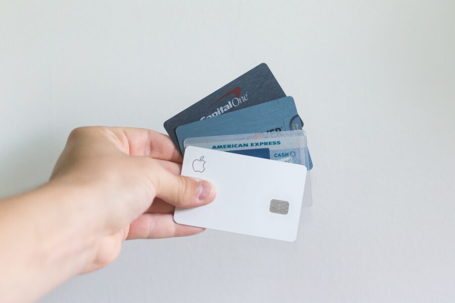 Person holding secured credit card wallet table