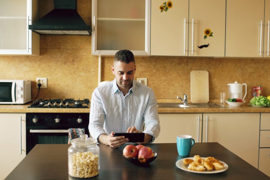 Person using banking app kitchen table