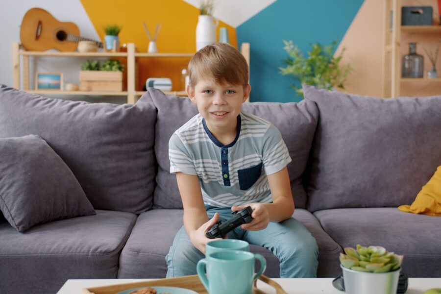 Babysitter playing board game child living room