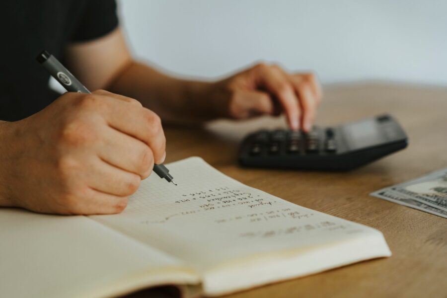 Person writing financial