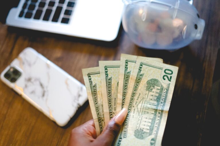 Piggy bank labeled envelopes table