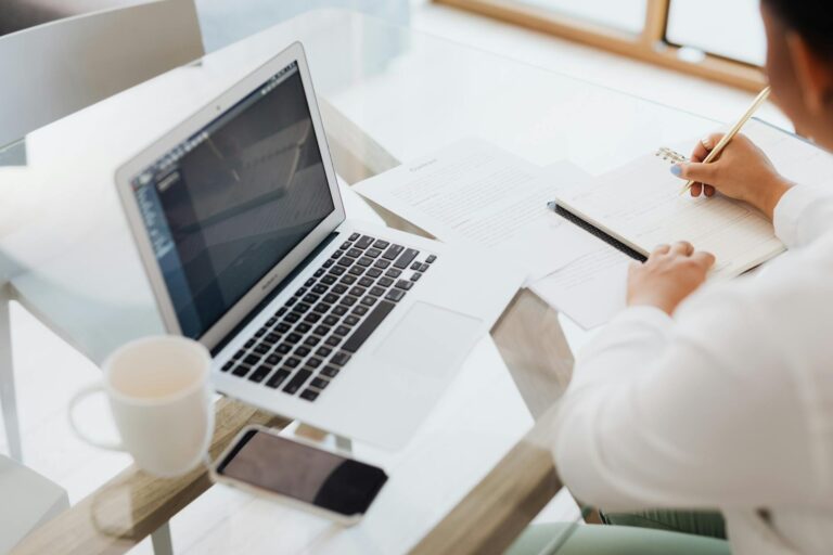 Person working desk notebook laptop coffee