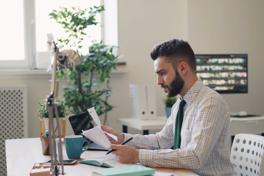 Person reading credit report desk