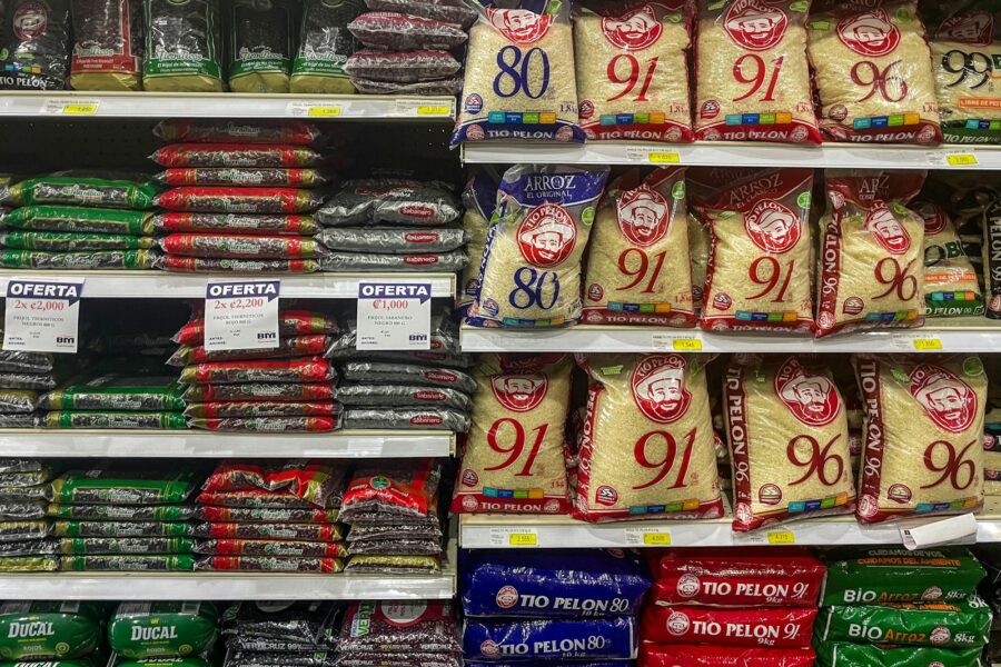 Supermarket aisle grocery shelves price labels