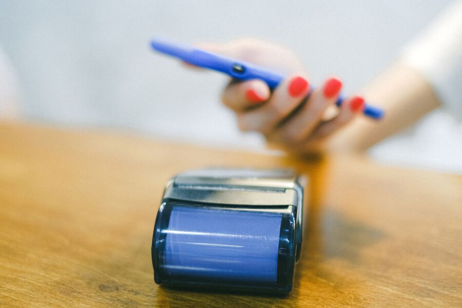 Person paying smartphone