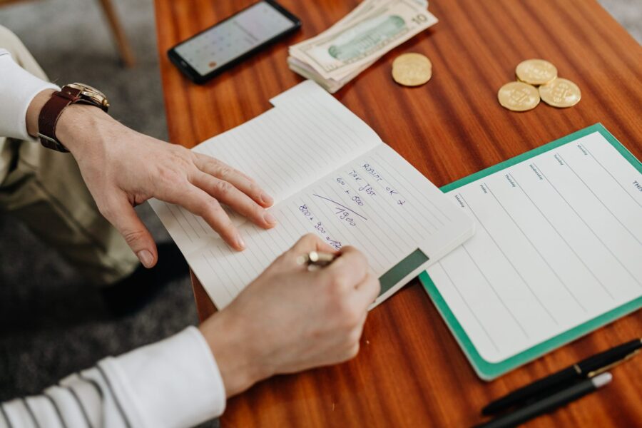 Person writing saving