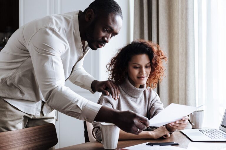 Diverse couple reviewing